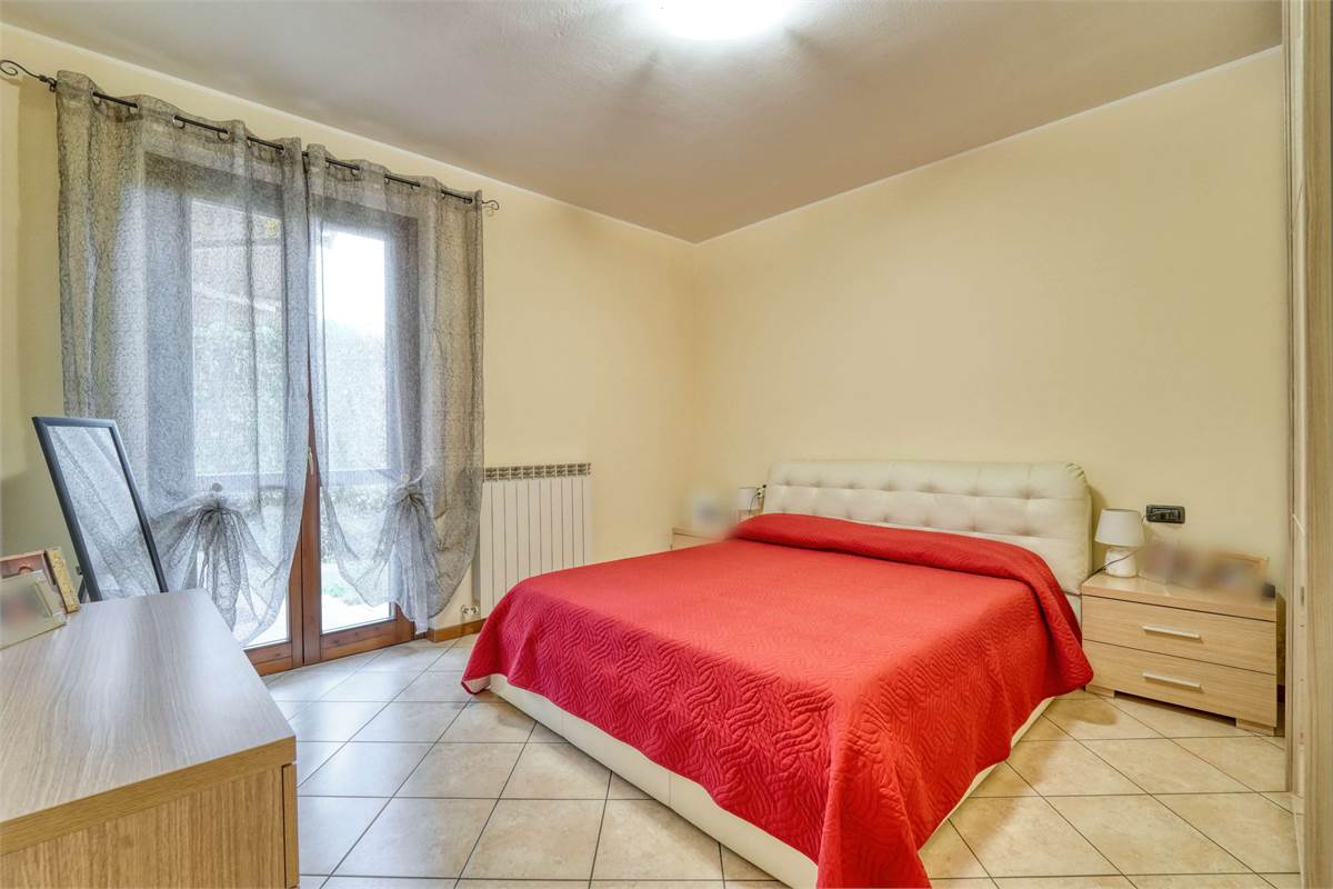 Trilocale al PT con giardino taverna e box